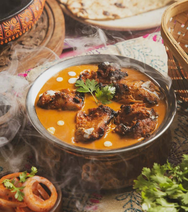 Butter chicken in a copper bowl with steam rising - the kind of dish we film for Indian restaurant reels